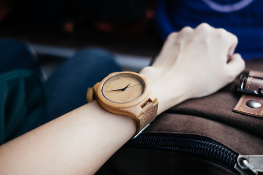 classic accessory background hand of business women wearing wooden watch with copy space. image for body, retro, outdoor, vintage, luxury, equipment concept