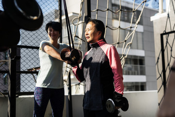 People exercising at fitness gym