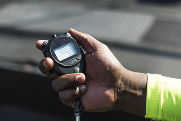 Closeup of hand holding stopwatch