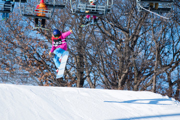 People are having fun in downhill skiing and snowboarding