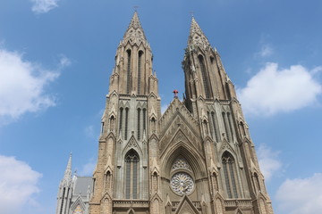 Fototapeta na wymiar Towers of the church with clear blue sky background 