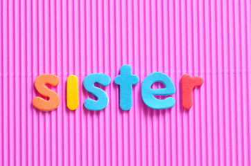 The word sister on a pink background
