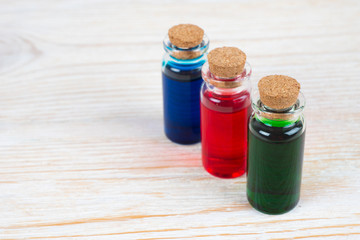 colorful essential oil for aromatherapy and massage on wooden table