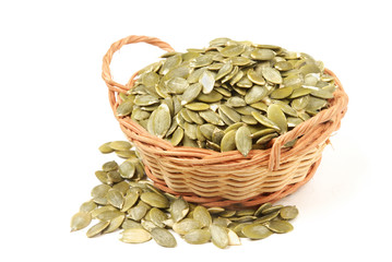 Pumpkin seeds on white background.