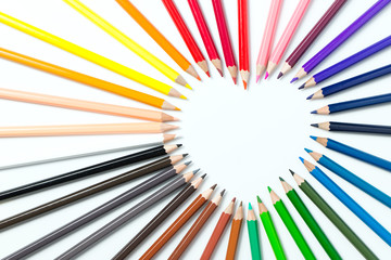 Color pencils arranged in a heart shape