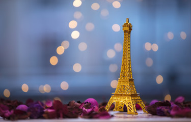 Eiffel tower souvenir with purple herbs and leaves