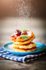 Delicious pancakes on wooden table with Cup of coffee and jam
