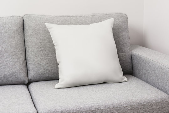 Blank White Pillow On A Couch.