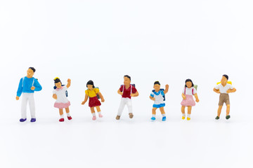 Miniature people: Group of children on white background. Image use for education,  preparing for opening day of study.