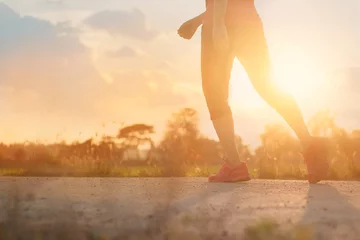 Papier Peint photo Jogging Athlete woman walking exercise on rural road in sunset background, healthy and lifestyle concept