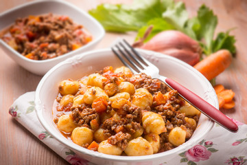 homemade gnocchi with ragout sauce, selective focus