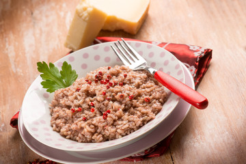 risotto with red wine red pepper and parmesan cheese, selective focus