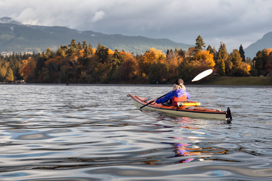 Kayaking in Autumn near Stanley Park, Downtown Vancouver, BC, Canada.