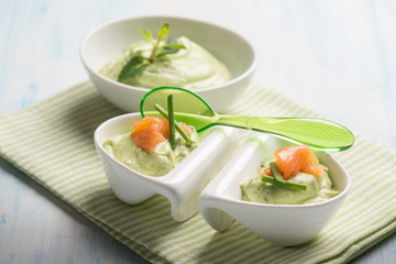 appetizer with smoked salmon and avocado cream, selective focus