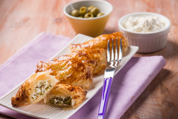 little strudel filled with ricotta and olives, selective focus