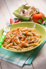pasta with tuna anchovies tomato and hot chili pepper, selective focus