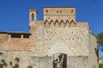 Fototapeta na wymiar Porta San Giovanni, entrance gate to the historical center of San Gimignano, Siena, Tuscany, Italy