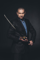 modern samurai with katana sword on black