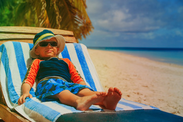 Fototapeta na wymiar little boy relax at summer beach
