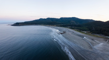 Aerial Panoramic Landscape View of Pacific Ocean Coast in Washington State. Taken during a vibrant sunrise.