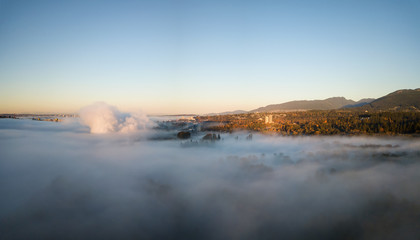Aerial view above the fog of Horseshoe Bay, West Vancouver, British Columbia, Canada.