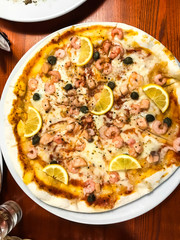 Homemade pizza with seafood