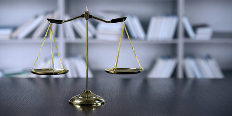 Law and Justice concept. Mallet of the judge, books, scales of justice. Gray stone background,...