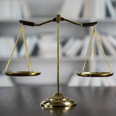 Law and Justice concept. Mallet of the judge, books, scales of justice. Gray stone background,...