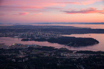 Aerial view of the beautiful city during a vibrant sunset. Taken in Vancouver, British Columbia, Canada.
