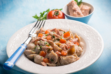 pasta with tuna and fresh tomatoes, selective focus