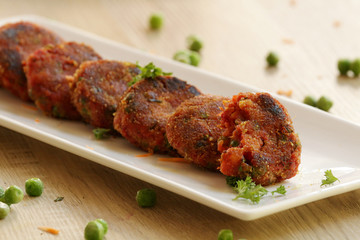 Vegetable cutlet or patties are a delicious snack made from boiled mixed vegetables. This can be eaten like that or kept inside a burger bun and served with tomato ketchup.
