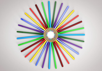 Colored pencils spread out in a circle. All colors of the rainbow.