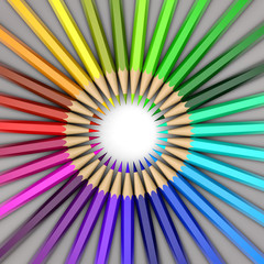 Colored pencils spread out in a circle. All colors of the rainbow.