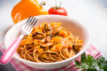 pasta with mussel capsicum and tomato sauce, selective focus