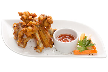 Chicken legs in batter with vegetables isolated