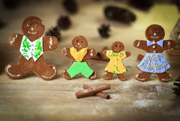 cheerful gingerbread men gingerbread house on the table