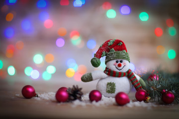 Christmas card. toy snowman on Christmas background.