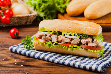 Delicious tuna sandwich, served with lettuce, tomato and onion.