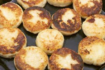 cheese pancakes on the dripping pan. top view