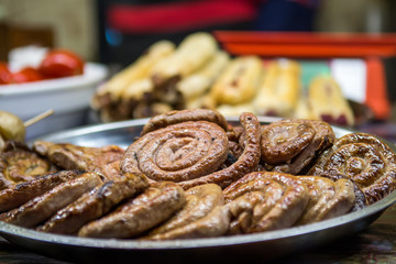 Grilled sausages at Christmas food market.