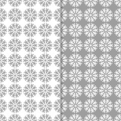 White and gray floral backgrounds. Set of seamless patterns