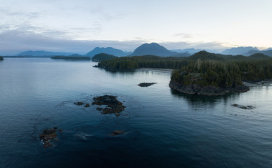 Aerial panoramic landscape view of the rocky Pacific Ocean Coast during a vibrant summer morning. Taken in Ucluelet, Vancouver Island, British Columbia, Canada.
