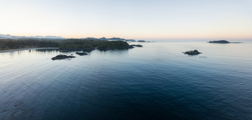Aerial panoramic landscape view of the rocky Pacific Ocean Coast during a vibrant summer morning. Taken in Ucluelet, Vancouver Island, British Columbia, Canada.
