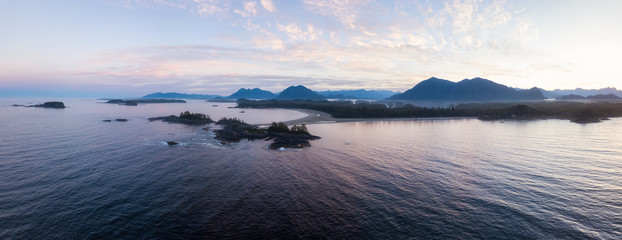 Aerial panoramic view of the beautiful Pacific Ocean Coast during a vibrant summer sunrise. Taken near Tofino, Vancouver Island, British Columbia, Canada.   © edb3_16
