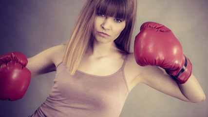 Woman wearing boxing gloves