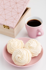 Homemade zephyr or marshmallow with coffee on white background