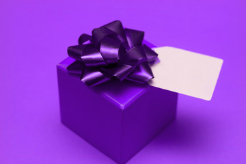 gift box with festive box and blank label for text painted ultra violet.demonstration color 0f 2018 year Pantone