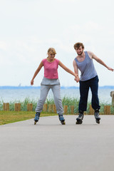 Obraz premium roller skater couple skating outdoor