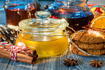 Cozy still life with tea, candle light and honey