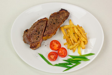 Fresh beef rare steak and black pepper